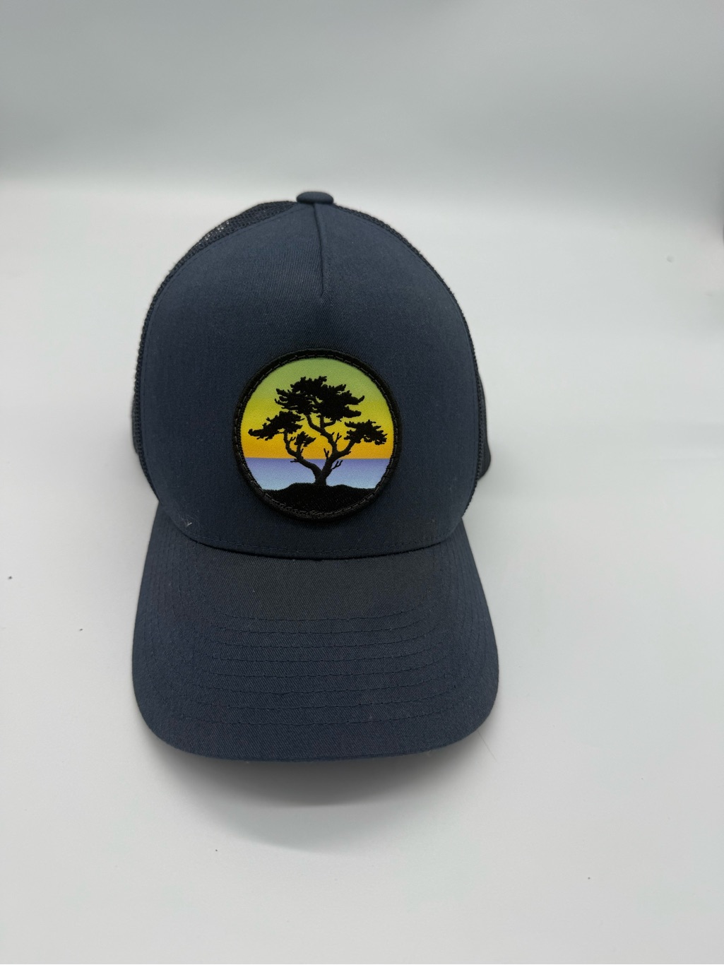 The Classic Navy Trucker Hat With Sunset Tree Patch